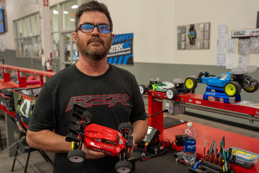 James McDonald holding his LC Racing EMB-1 buggy in the pits at Hobby Action RC Raceway
